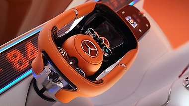 The steering wheel is equipped with various function keys and state-of-the-art touch elements.