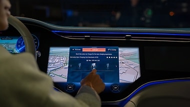 The navigation includes an Electric Intelligence feature that calculates time-efficient routes that include charging stops.