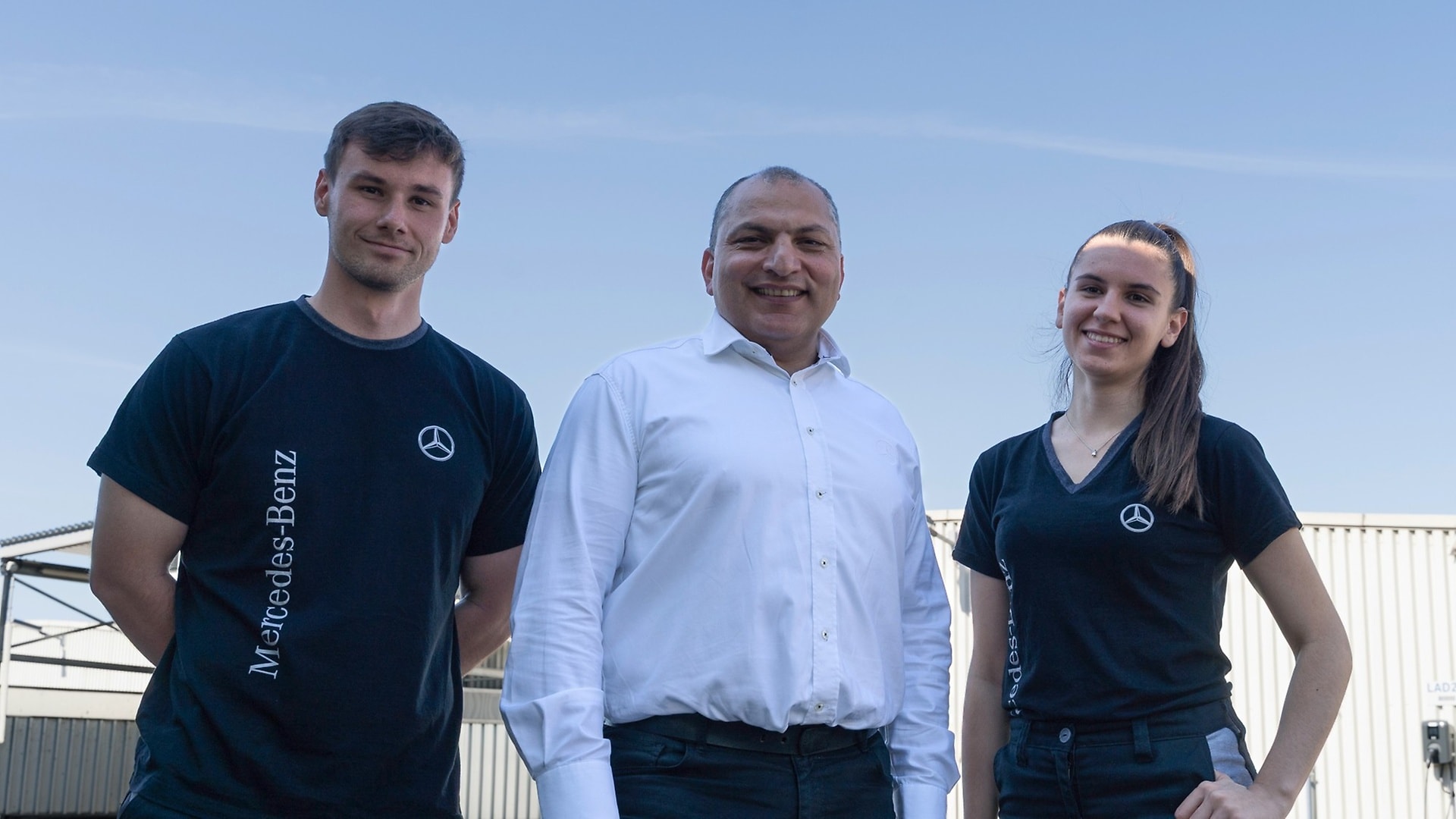 Holiday worker Manuel and  Lorena with group leader Mehmet.