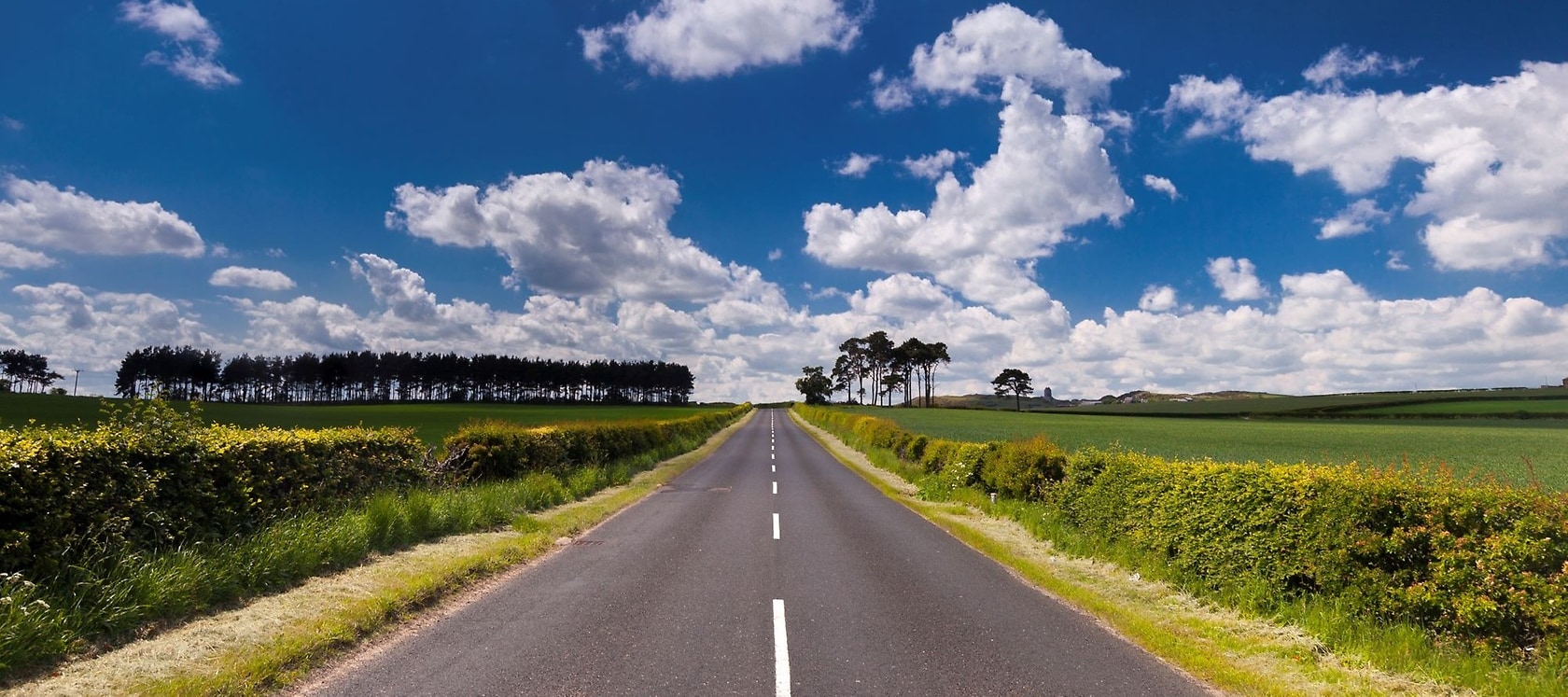 Road leads towards the horizon.