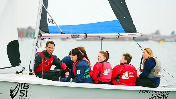 English yachtsman and Laureus Ambassador Ben Ainslie takes the kids out on the water.