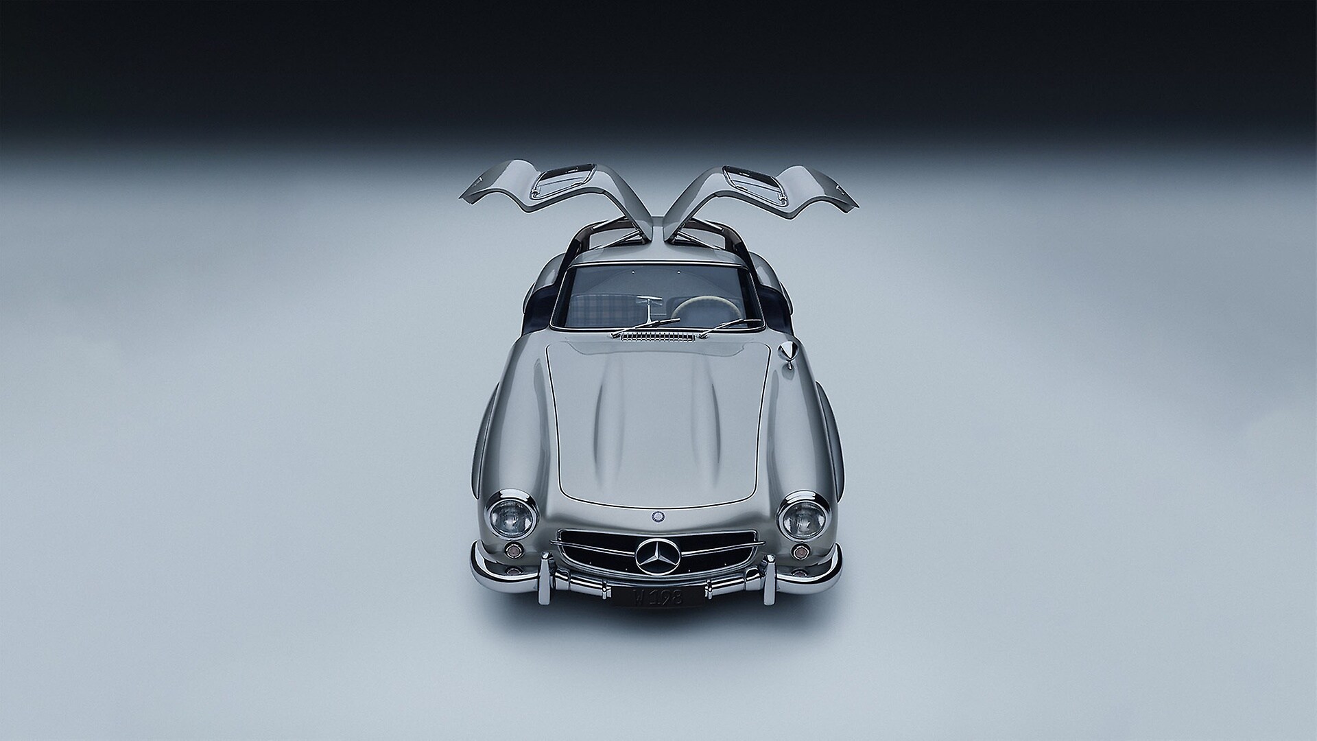 Mercedes-Benz 300 SL „Flügeltürer“ (W 198), Produktionszeit 1954 bis 1957. Fahrzeug aus dem Jahr 1955. Studioaufnahme von vorn mit geöffneten Flügeltüren aus dem Jahr 2025.